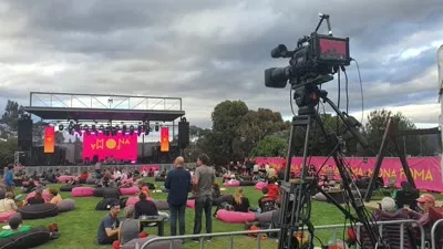 Camera on sticks at an outdoor MONA festival event